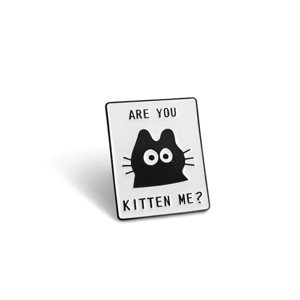 Soulpurrpose enamel pin with black cat face and 'Are You Kitten Me?' text, pet lover gift