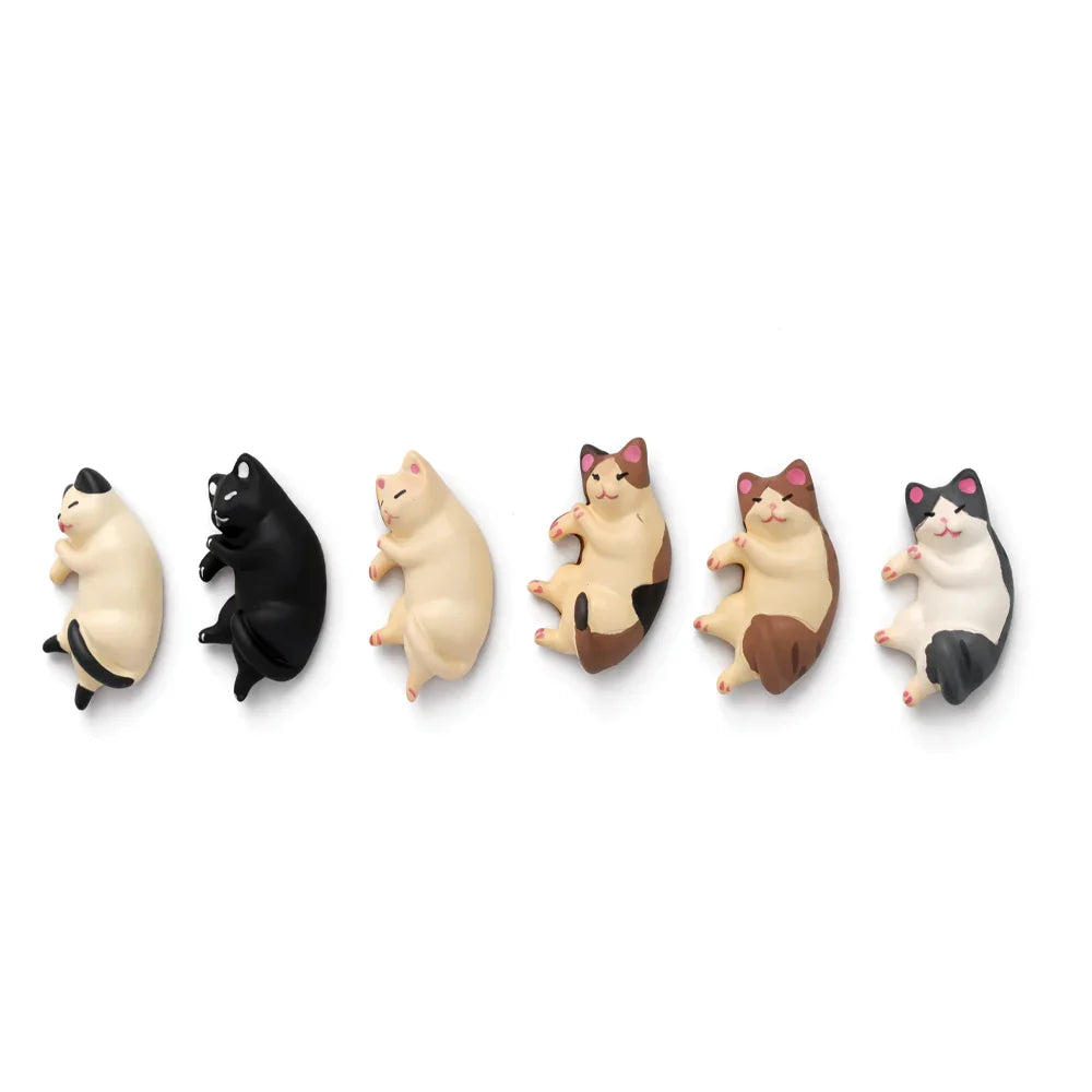 Six cute cat figurines in different colors, lying on their sides, Soulpurrpose pet decor