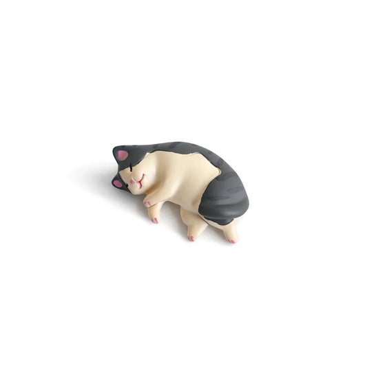 Cute cat figurine with black stripes lying down on white background, Soulpurrpose pet decor
